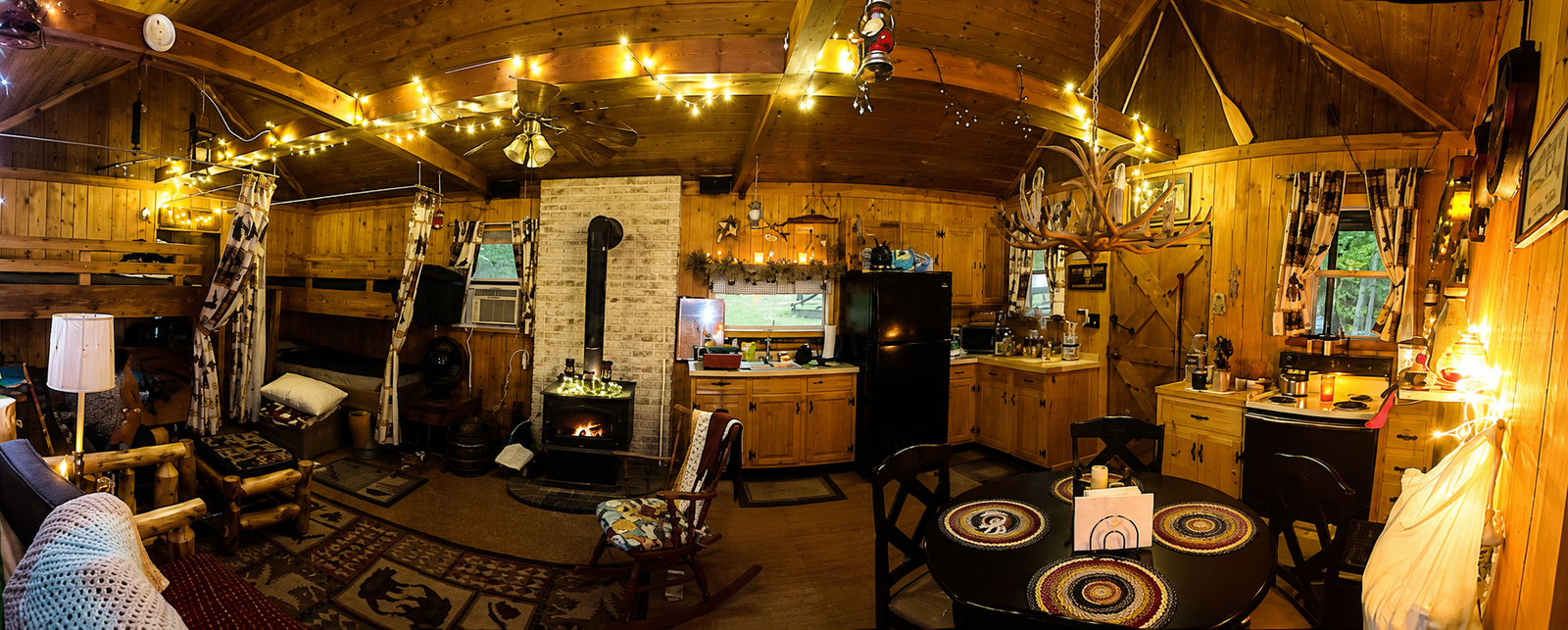Panoramic view of the cozy cabin living room.